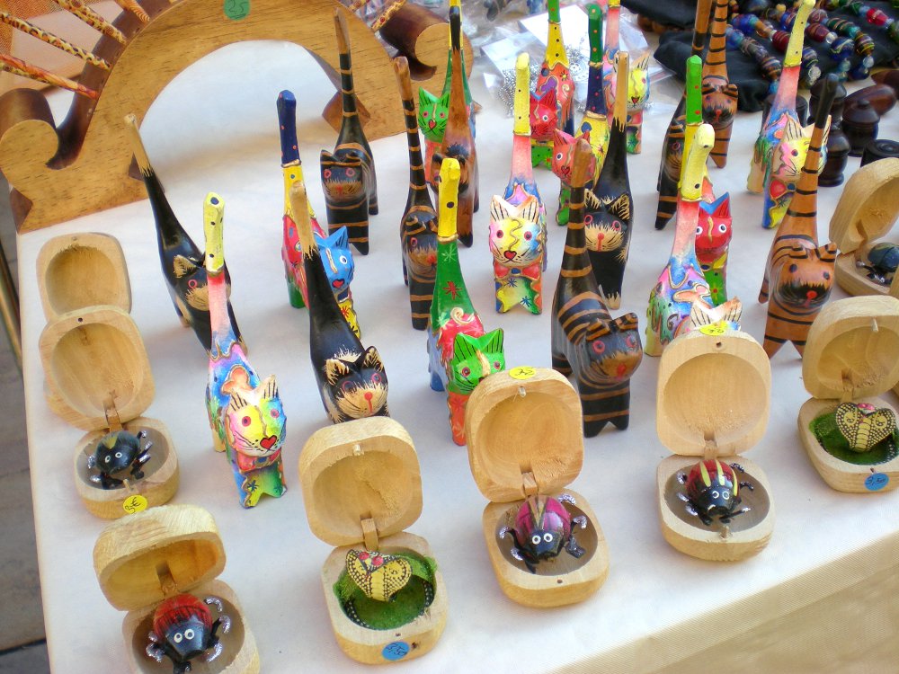 Wooden Cat Ring Holder Statues on display